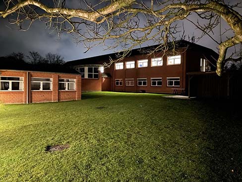 The office in which SelfBack is located, lit up at night.